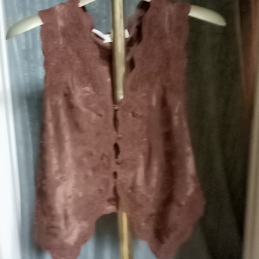 Brown. Sleeveless vest